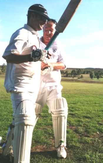 Centurion Michael Cumbo is congratulated by team-mate Steve Radford. CumboMick100-Steve Radford 350pix